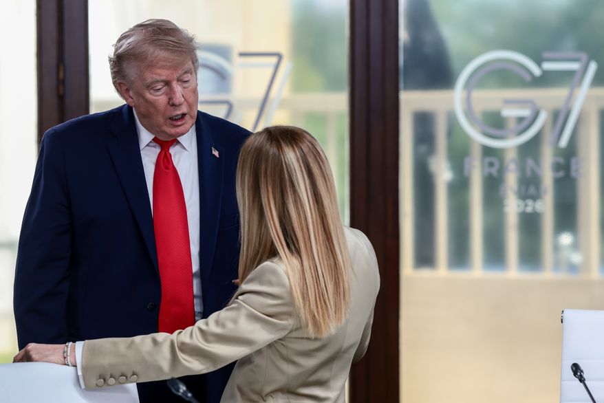 President Donald Trump speaks with Italian Prime Minister Giorgia Meloni at a working lunch with leaders of G7 and the Middle East in Evian-les-Bains, France, Tuesday, June 16, 2026. (Evelyn Hockstein/Pool Photo via AP)