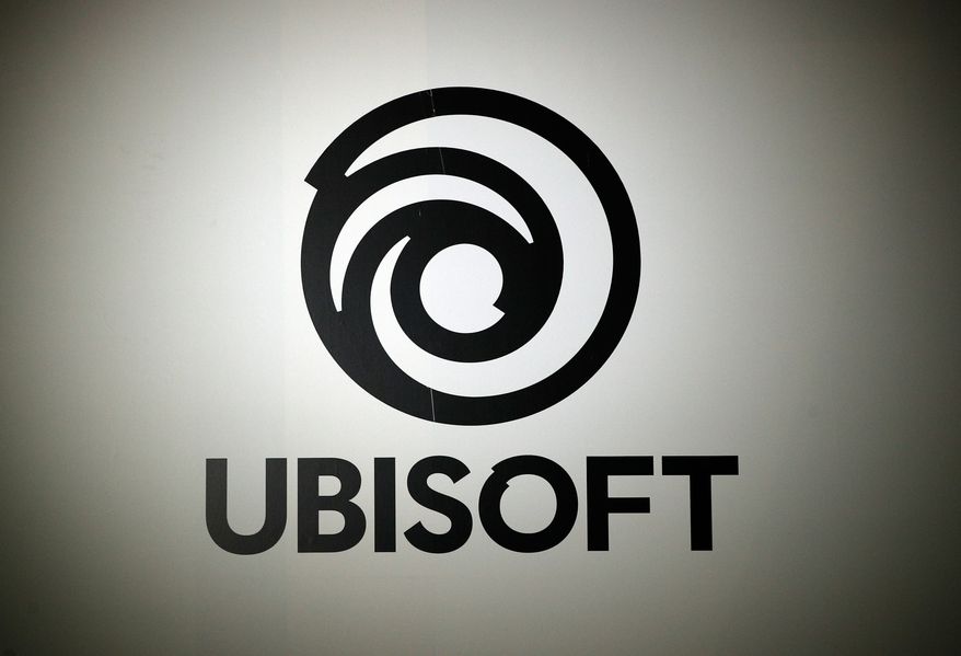 The logo of French video game publisher Ubisoft is pictured at the Paris games week in Paris, Nov. 4, 2017. (AP Photo/Christophe Ena, File)