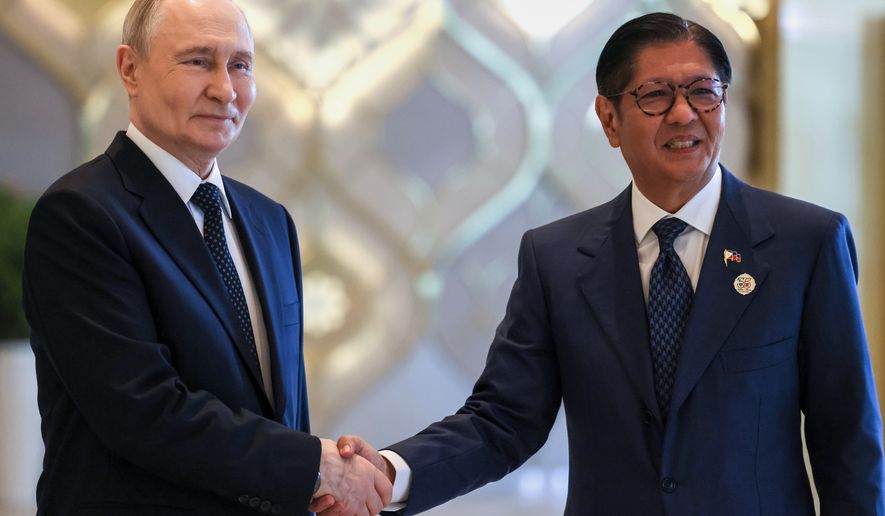 Russian President Vladimir Putin, left, and Philippine President Ferdinand Marcos Jr. pose for a photo on the sidelines of the Russia-ASEAN summit in Kazan, Russia, Wednesday, June 17, 2026. (Mikhail Metzel/Sputnik, Kremlin Pool Photo via AP)