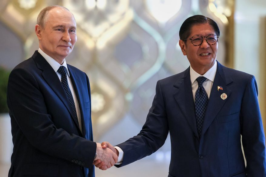Russian President Vladimir Putin, left, and Philippine President Ferdinand Marcos Jr. pose for a photo on the sidelines of the Russia-ASEAN summit in Kazan, Russia, Wednesday, June 17, 2026. (Mikhail Metzel/Sputnik, Kremlin Pool Photo via AP)
