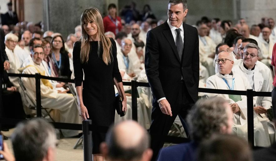 Spain's Prime Minister Pedro Sanchez and his wife Begona Gomez arrive before a Mass celebrated by Pope Leo XIV at the Basilica of the Sagrada Familia in Barcelona, Spain, Wednesday, June 10, 2026. (AP Photo/Bernat Armangue)