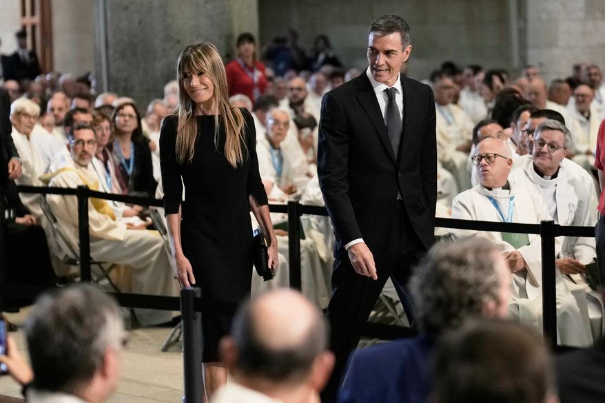 Spain's Prime Minister Pedro Sanchez and his wife Begona Gomez arrive before a Mass celebrated by Pope Leo XIV at the Basilica of the Sagrada Familia in Barcelona, Spain, Wednesday, June 10, 2026. (AP Photo/Bernat Armangue)