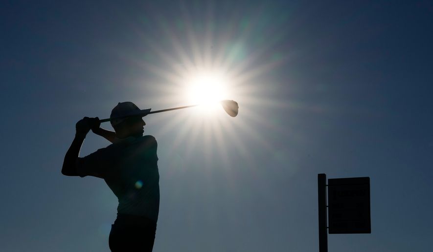 Sam Stevens watches his tee shot on the 14th hole during the third round of the U.S. Open golf tournament at Shinnecock Hills Golf Club in Southampton, N.Y., Saturday, June 20, 2026.(AP Photo/David J. Phillip)
