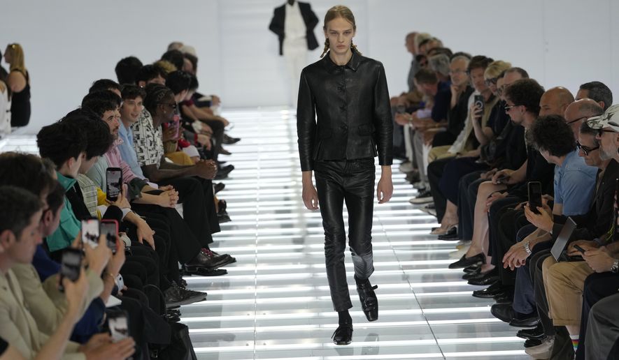A model wears a creation from Prada's Spring/Summer 2027 men's collection presented in Milan, Italy, Sunday, June 21, 2026. (AP Photo/Luca Bruno)