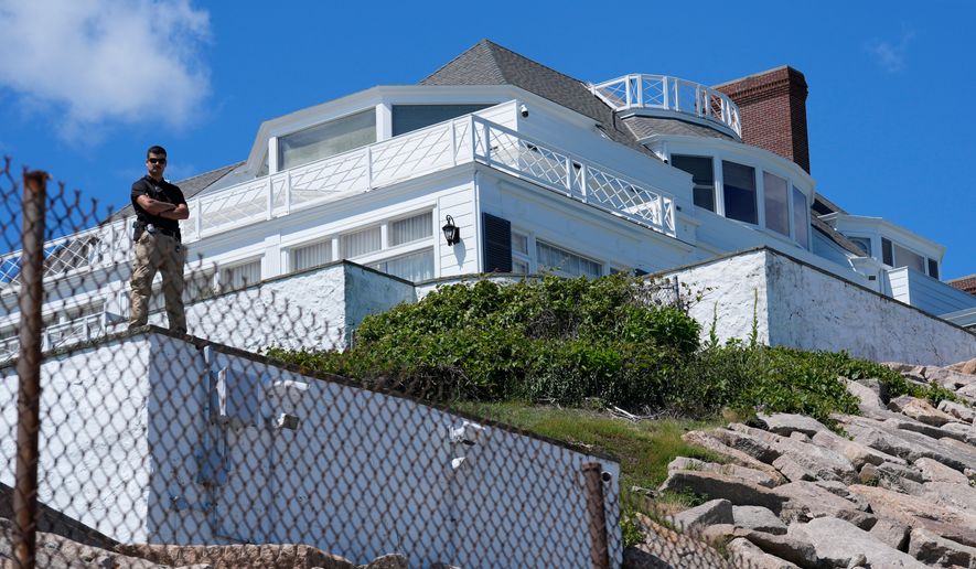 A security guard stands watch at Taylor Swift's "Holiday House," Saturday, June 20, 2026, in Westerly, R.I. (AP Photo/Robert F. Bukaty)