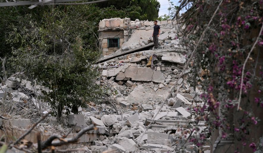 A man checks his destroyed house following a ceasefire between Israel and Hezbollah in the village of Maifadoun, southern Lebanon, Monday, June 22, 2026. (AP Photo/Mohammed Zaatari)
