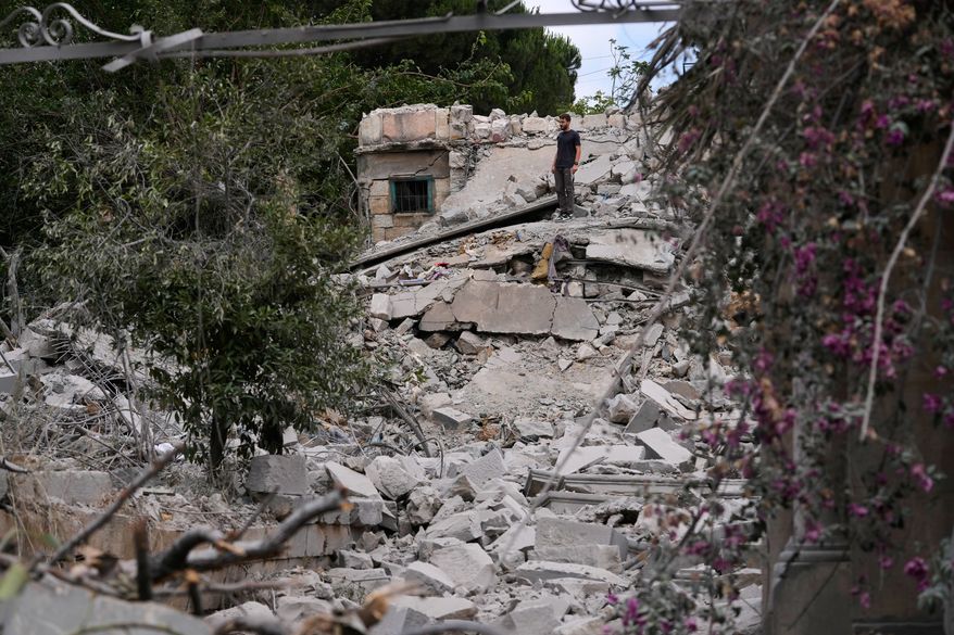 A man checks his destroyed house following a ceasefire between Israel and Hezbollah in the village of Maifadoun, southern Lebanon, Monday, June 22, 2026. (AP Photo/Mohammed Zaatari)