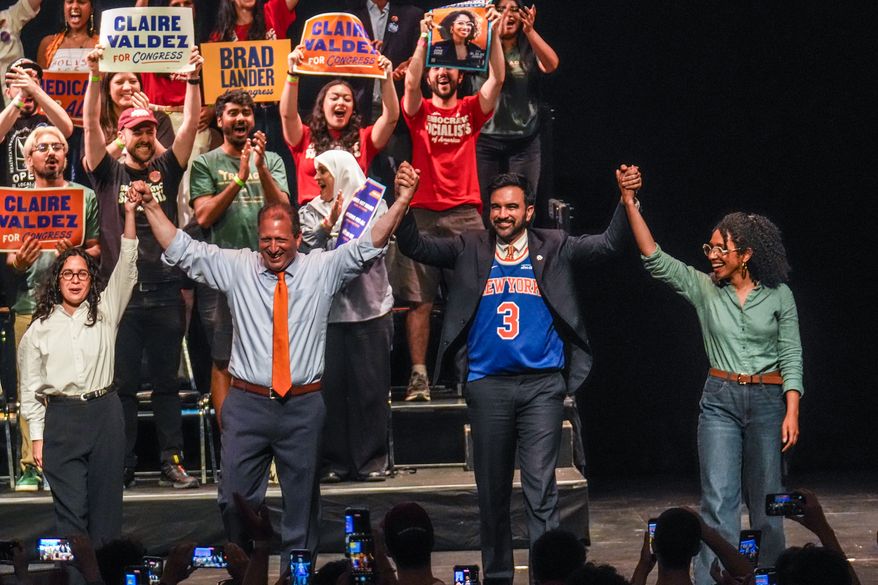 Democratic congressional candidates, Claire Valdez, Brad Lander, and Darializa Avila Chevalier gesture on stage with Mayor Zohran Mamdani during a Get Out The Vote rally ahead of New York's primary election, Thursday, June 18, 2026, in the Brooklyn borough of New York. (AP Photo/Ryan Murphy)