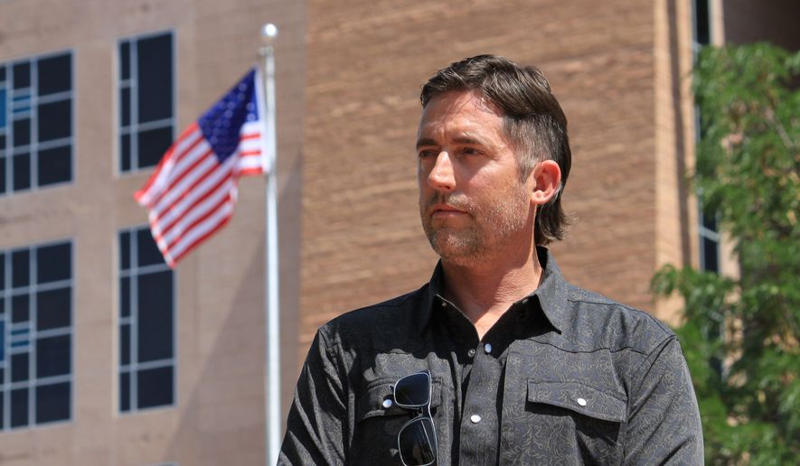 DEA Special Agent David Howell, who filed a whistleblower complaint, poses for a portrait outside the U.S. District Court in Albuquerque, N.M., on Friday, June 12, 2026. (AP Photo/Susan Montoya Bryan)