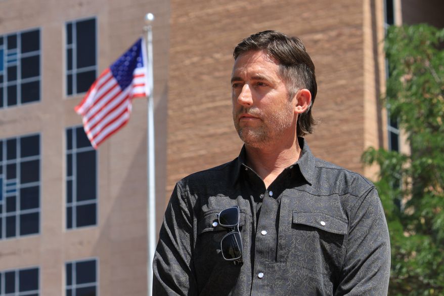 DEA Special Agent David Howell, who filed a whistleblower complaint, poses for a portrait outside the U.S. District Court in Albuquerque, N.M., on Friday, June 12, 2026. (AP Photo/Susan Montoya Bryan)