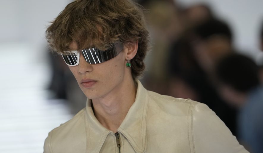 A model wears a creation from Prada's Spring/Summer 2027 men's collection presented in Milan, Italy, Sunday, June 21, 2026. (AP Photo/Luca Bruno)