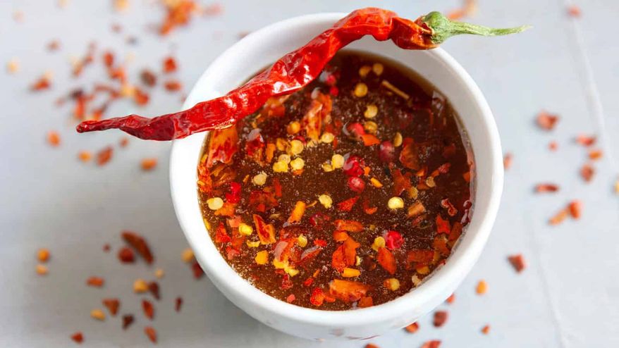 Hot honey, spicy mango, chili crisp: sweet heat is the flavor moment of 2026. Here's how to get in on it. Photo credit: Depositphotos.