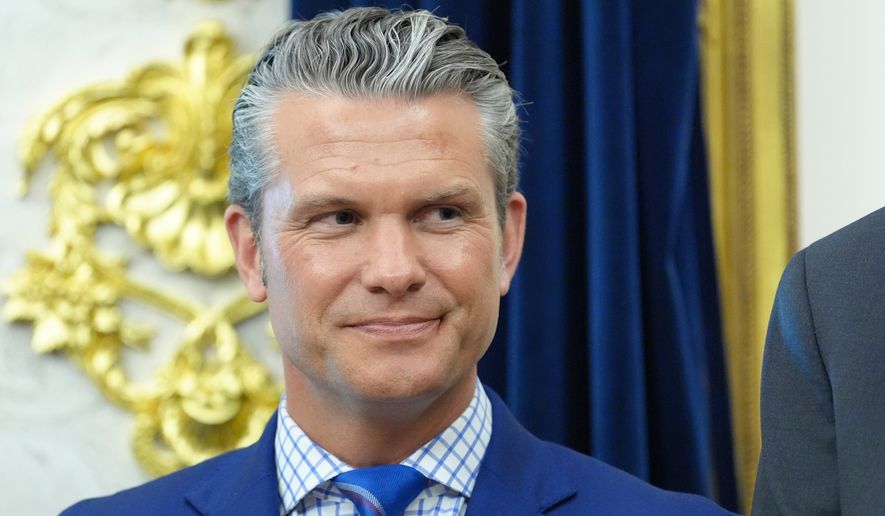 Defense Secretary Pete Hegseth listens as President Donald Trump speaks in the Oval Office of the White House during an executive order signing about quantum computing, Monday, June 22, 2026, in Washington. (AP Photo/Jacquelyn Martin) ** FILE **
