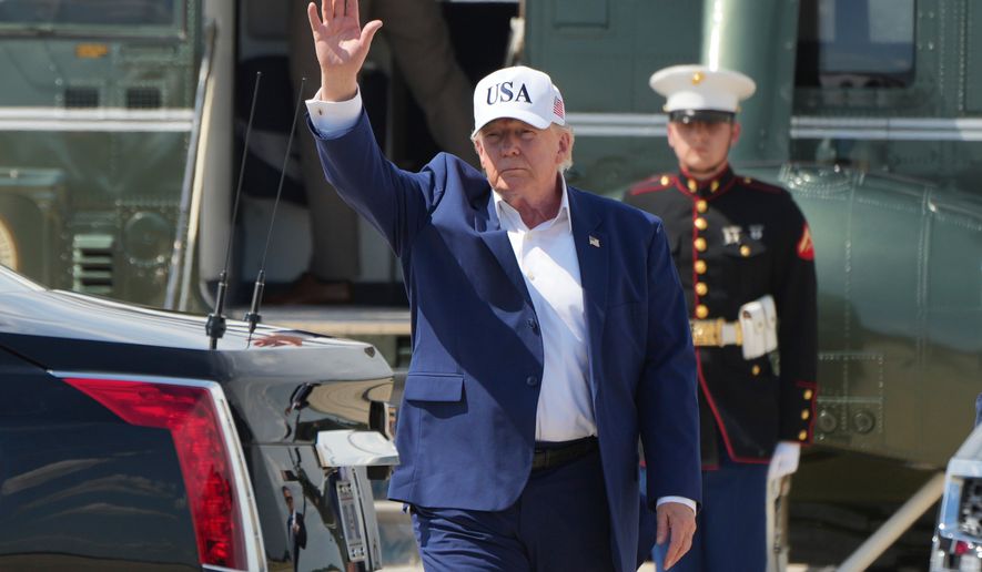 President Donald Trump waves as he arrives on Marine One at Joint Base Andrews, Md., Sunday, June 21, 2026, following a trip to Camp David. (AP Photo/Mark Schiefelbein)