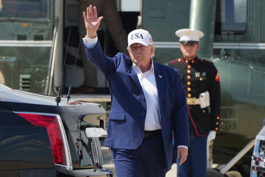 President Donald Trump waves as he arrives on Marine One at Joint Base Andrews, Md., Sunday, June 21, 2026, following a trip to Camp David. (AP Photo/Mark Schiefelbein)