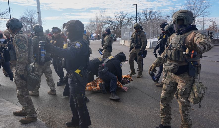 Protesters demonstrate against Immigration and Customs Enforcement (ICE) after Renee Good, who was fatally shot by an ICE officer earlier, Jan. 12, 2026, in Minneapolis. (AP Photo/Jen Golbeck, File)