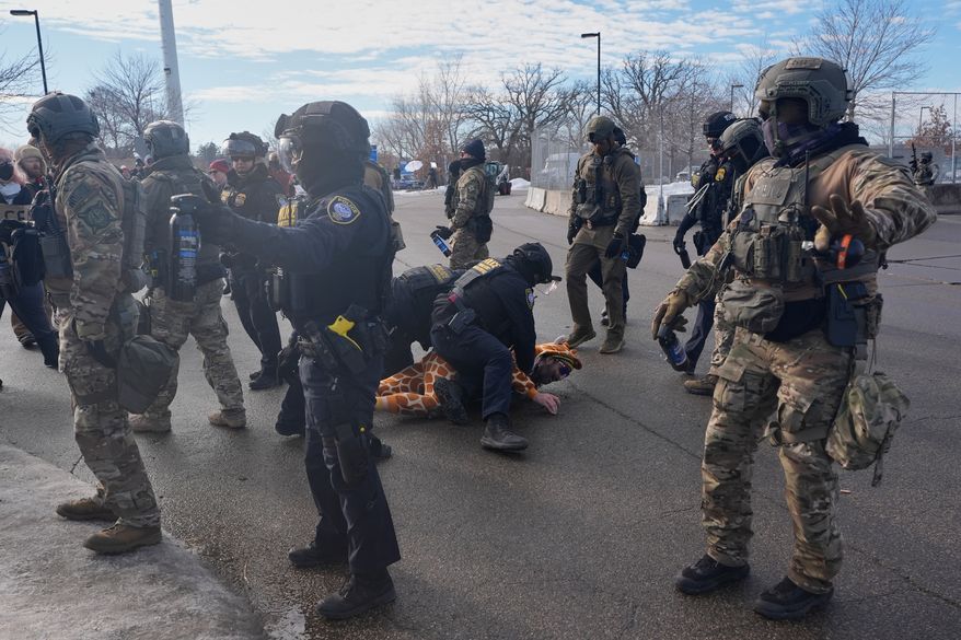 Protesters demonstrate against Immigration and Customs Enforcement (ICE) after Renee Good, who was fatally shot by an ICE officer earlier, Jan. 12, 2026, in Minneapolis. (AP Photo/Jen Golbeck, File)