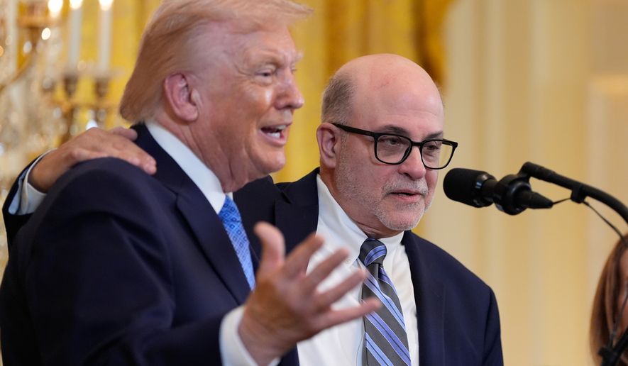 Mark Levin listens as President Donald Trump speaks during a Hanukkah reception in the East Room of the White House, Tuesday, Dec. 16, 2025, in Washington. (AP Photo/Alex Brandon)
