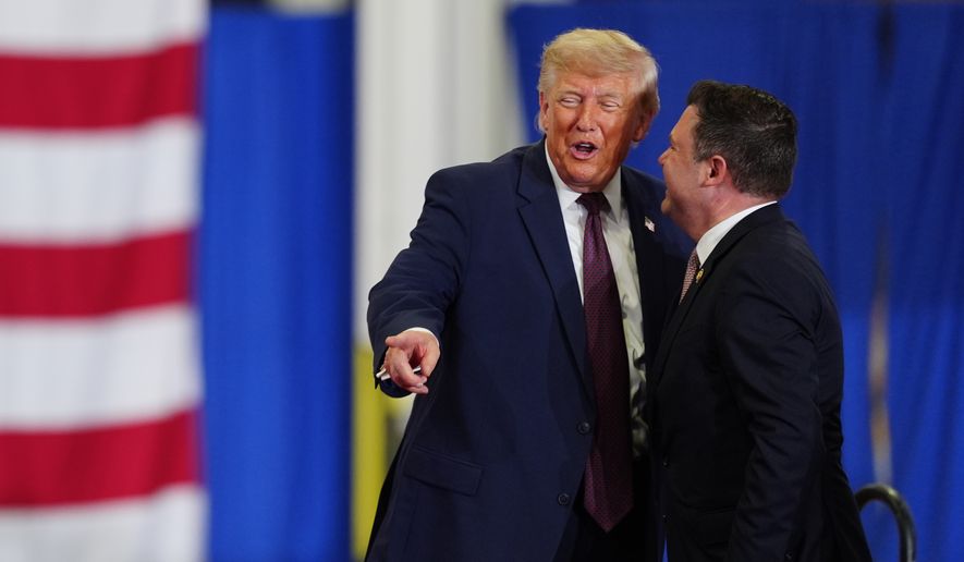 President Donald Trump and Rep. Ryan Mackenzie, R-Pa., right, appear on stage together during an event at a Mack Trucks facility, Tuesday, June 23, 2026, in Macungie, Pa. (AP Photo/Julia Demaree Nikhinson)
