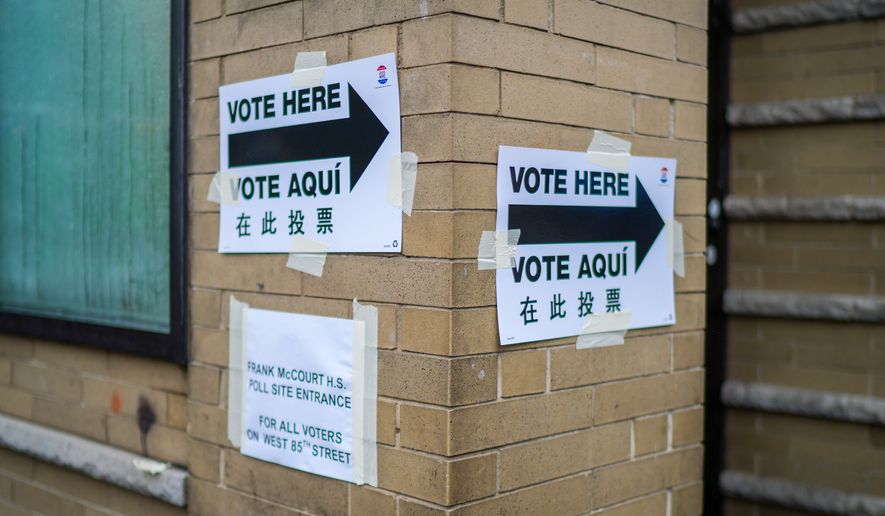 Voting signs are displayed outside a polling station on Election Day during New York’s primary election on Tuesday, June 23, 2026, in New York. (AP Photo/Ryan Murphy)