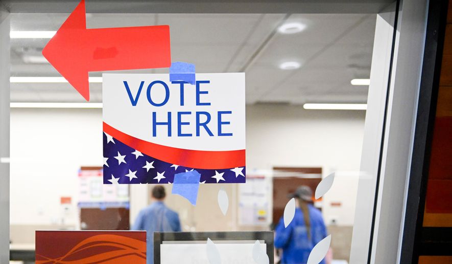 A sign hangs at a voting center during Utah's primary election on Tuesday, June 23, 2026, in Salt Lake City. (AP Photo/Alex Goodlett)