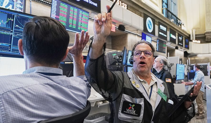 Options trader Anthony Spina, center, works on the floor of the New York Stock Exchange, Tuesday, June 16, 2026. (AP Photo/Richard Drew)