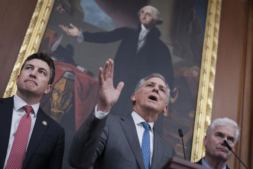 House Financial Services Chairman French Hill, R-Ark., center, is flanked by Rep. Bryan Steil, R-Wis., left, and Majority Whip Tom Emmer, R-Minn., as they speak to reporters after the House passed three bills intended to boost the legitimacy of the cryptocurrency industry with new regulations demanded by President Donald Trump, at the Capitol in Washington, Thursday, July 17, 2025. (AP Photo/J. Scott Applewhite)