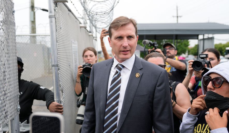 Rep. Dan Goldman, D-N.Y., gets ready to enter the Delaney Hall detention center as a protest against the transfer of detainees takes place on Wednesday, May 27, 2026, in Newark, N.J. (AP Photo/Seth Wenig)