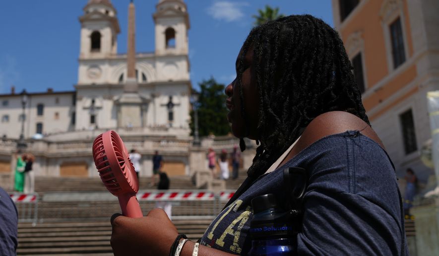 A woman visits the historical Spanish steps in Rome, Tuesday, June 23, 2026. (AP Photo/Alessandra Tarantino)