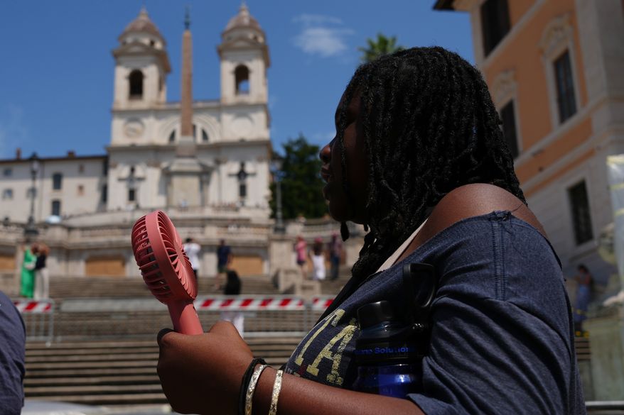 A woman visits the historical Spanish steps in Rome, Tuesday, June 23, 2026. (AP Photo/Alessandra Tarantino)