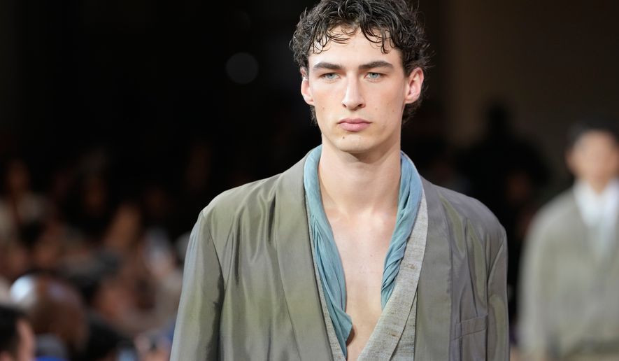 A model wears a creation as part of the Giorgio Armani Spring/Summer 2027 men's collection presented in Milan, Italy, Monday, June 22, 2026. (AP Photo/Luca Bruno)