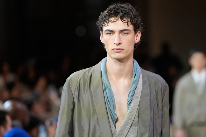 A model wears a creation as part of the Giorgio Armani Spring/Summer 2027 men's collection presented in Milan, Italy, Monday, June 22, 2026. (AP Photo/Luca Bruno)