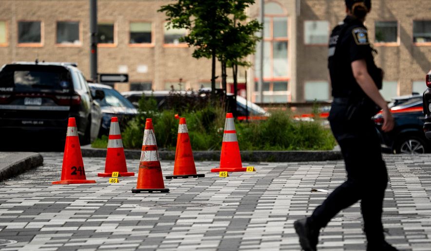 Montreal police work the scene of a shooting the day before, in Montreal on Tuesday, June 23, 2026. (Christopher Katsarov/The Canadian Press via AP)