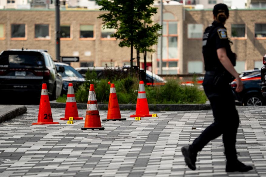 Montreal police work the scene of a shooting the day before, in Montreal on Tuesday, June 23, 2026. (Christopher Katsarov/The Canadian Press via AP)