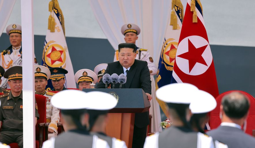 In this photo provided Wednesday, June 24, 2026, by the North Korean government, its leader Kim Jong-un, center, speaks during a commissioning ceremony of its destroyer Choe Hyon at the port in Nampo Tuesday, June 23, 2026. Independent journalists were not given access to cover the event depicted in this image distributed by the North Korean government. The content of this image is as provided and cannot be independently verified. Korean language watermark on image as provided by source reads: "KCNA" which is the abbreviation for Korean Central News Agency. (Korean Central News Agency/Korea News Service via AP)