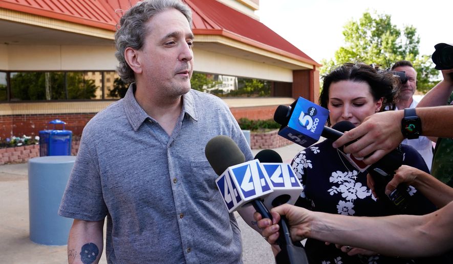 FILE - Former death row prisoner Richard Glossip, left, speaks to media after exiting a detention facility after being granted bond while awaiting retrial, May 14, 2026, in Oklahoma City. (AP Photo/Nick Oxford, File)