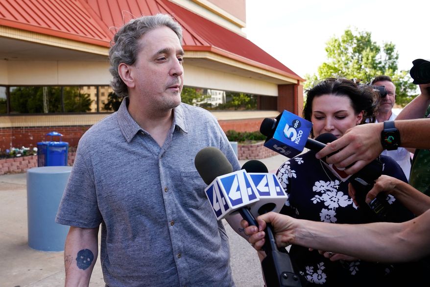 FILE - Former death row prisoner Richard Glossip, left, speaks to media after exiting a detention facility after being granted bond while awaiting retrial, May 14, 2026, in Oklahoma City. (AP Photo/Nick Oxford, File)