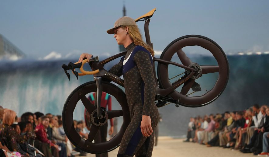 A model wears a creation as part of the Louis Vuitton men's Spring Summer 2027 collection presented in Paris, France, Tuesday, June 23, 2026. (AP Photo/Aurelien Morissard)