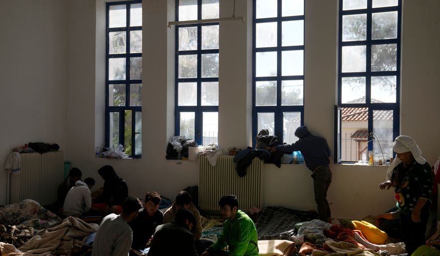 FILE - Migrants, most of them from Afghanistan, rest at an old school used as a temporary shelter on the island of Kythira, southern Greece, Oct. 7, 2022. (AP Photo/Thanassis Stavrakis, File)