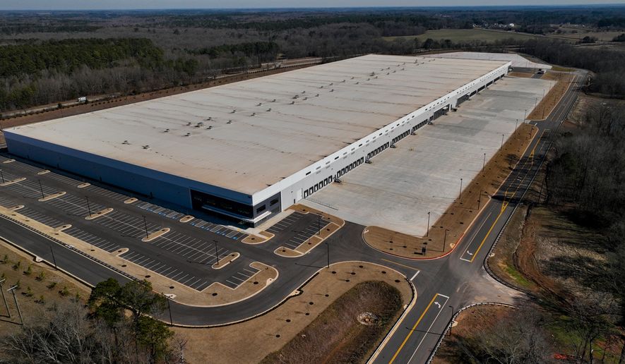 FILE - A newly built warehouse is seen on Friday, Feb. 6, 2026, in Social Circle, Ga., where officials are concerned about U.S. Immigrations and Customs Enforcement's plans connected to a $45-billion expansion of immigrant detention centers. (AP Photo/Mike Stewart, file)