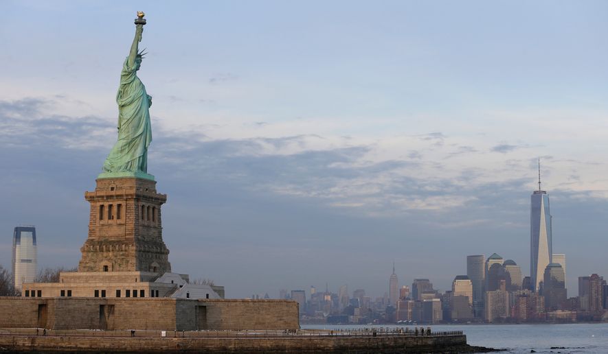 The lower Manhattan skyline, including the new One World Trade Center building at right, is shown as viewed from near the Statue of Liberty, Jan. 31, 2014, in New York. (AP Photo/Ted S. Warren, File)