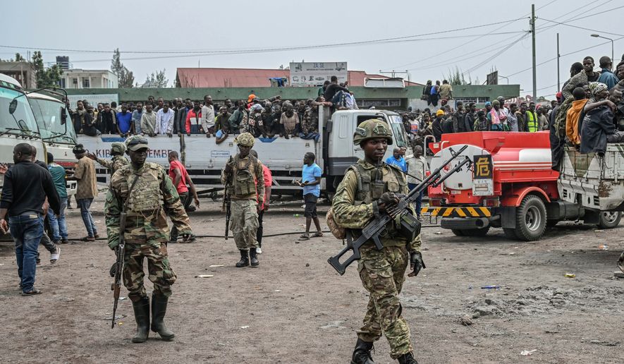 FILE - M23 rebels escort government soldiers and police who surrendered to an undisclosed location in Goma, Democratic republic of the Congo, Jan. 30, 2025. (AP Photo/Moses Sawasawa, File)