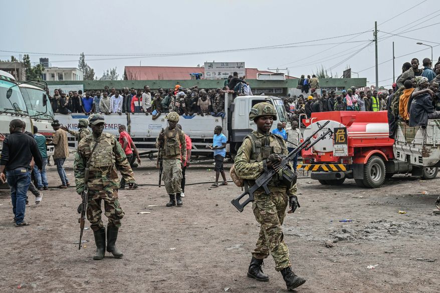 FILE - M23 rebels escort government soldiers and police who surrendered to an undisclosed location in Goma, Democratic republic of the Congo, Jan. 30, 2025. (AP Photo/Moses Sawasawa, File)