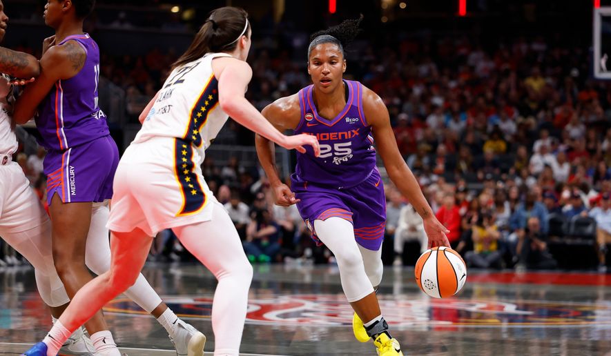 Phoenix Mercury forward Alyssa Thomas (25) drives towards the basket while defended by Indiana Fever guard Caitlin Clark (22) in the first half of play during a WNBA game between the Phoenix Mercury and the Indiana Fever on June 24, 2026 at Gainbridge Fieldhouse in Indianapolis, IN. (Photo by Jeffrey Brown/Icon Sportswire) (Icon Sportswire via AP Images)