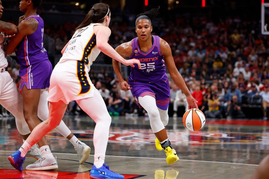 Phoenix Mercury forward Alyssa Thomas (25) drives towards the basket while defended by Indiana Fever guard Caitlin Clark (22) in the first half of play during a WNBA game between the Phoenix Mercury and the Indiana Fever on June 24, 2026 at Gainbridge Fieldhouse in Indianapolis, IN. (Photo by Jeffrey Brown/Icon Sportswire) (Icon Sportswire via AP Images)