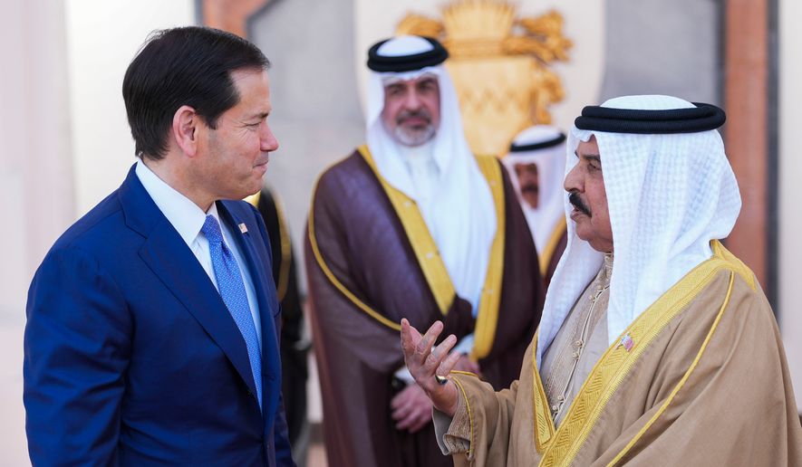 U.S. Secretary of State Marco Rubio, left, and Bahrain's King Hamad bin Isa Al Khalifa share a word after their meeting at Al-Sakhir Palace near Zallaq, Bahrain, Thursday, June 25, 2026. (Eric Lee/Pool Photo via AP) ** FILE **