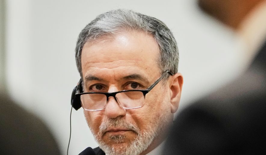 Iranian Foreign Minister Abbas Araghchi listens to his Iraqi counterpart Fouad Hussein during a news conference after a meeting at the foreign ministry in Baghdad, Iraq, Sunday, June 28, 2026. (AP Photo/Hadi Mizban)
