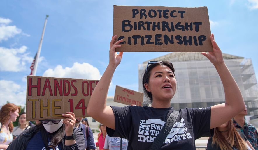 Hannah Liu, 26, of Washington holds up a sign in support of birthright citizenship outside of the Supreme Court in Washington on May 15, 2025. (AP Photo/Jacquelyn Martin) **FILE**