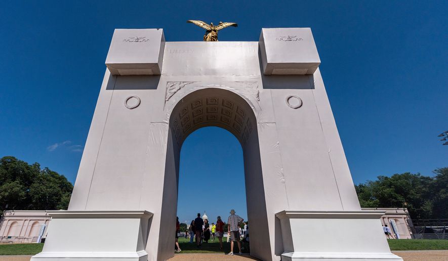 A mockup of President Donald Trump's proposed Triumphal Arch stands at the Great American State Fair on the National Mall, Monday, June 29, 2026, in Washington. (AP Photo/Jen Golbeck)