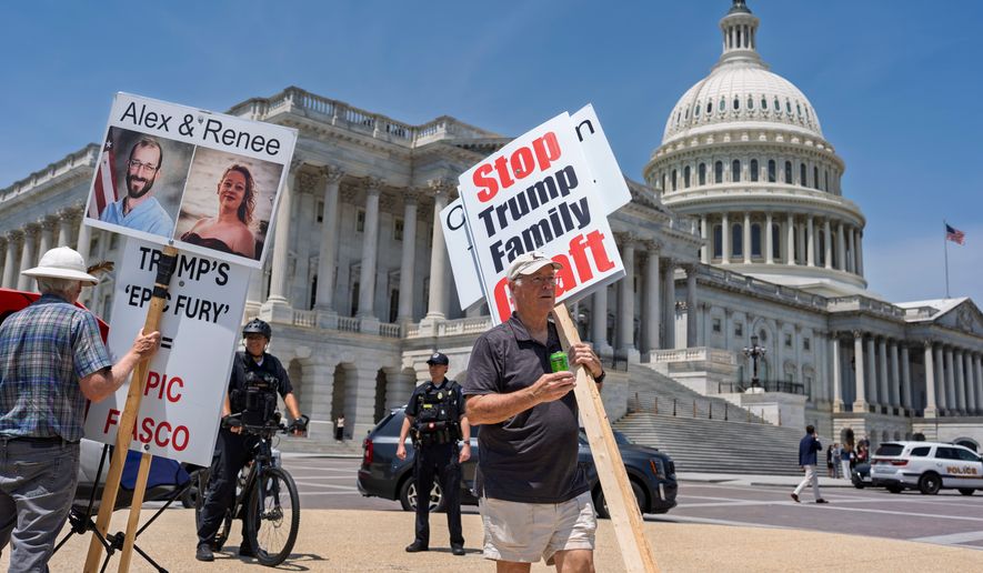 Activists endure high temperatures to protest against corruption and President Donald Trump at the Capitol in Washington, Tuesday, June 30, 2026. (AP Photo/J. Scott Applewhite) **FILE**